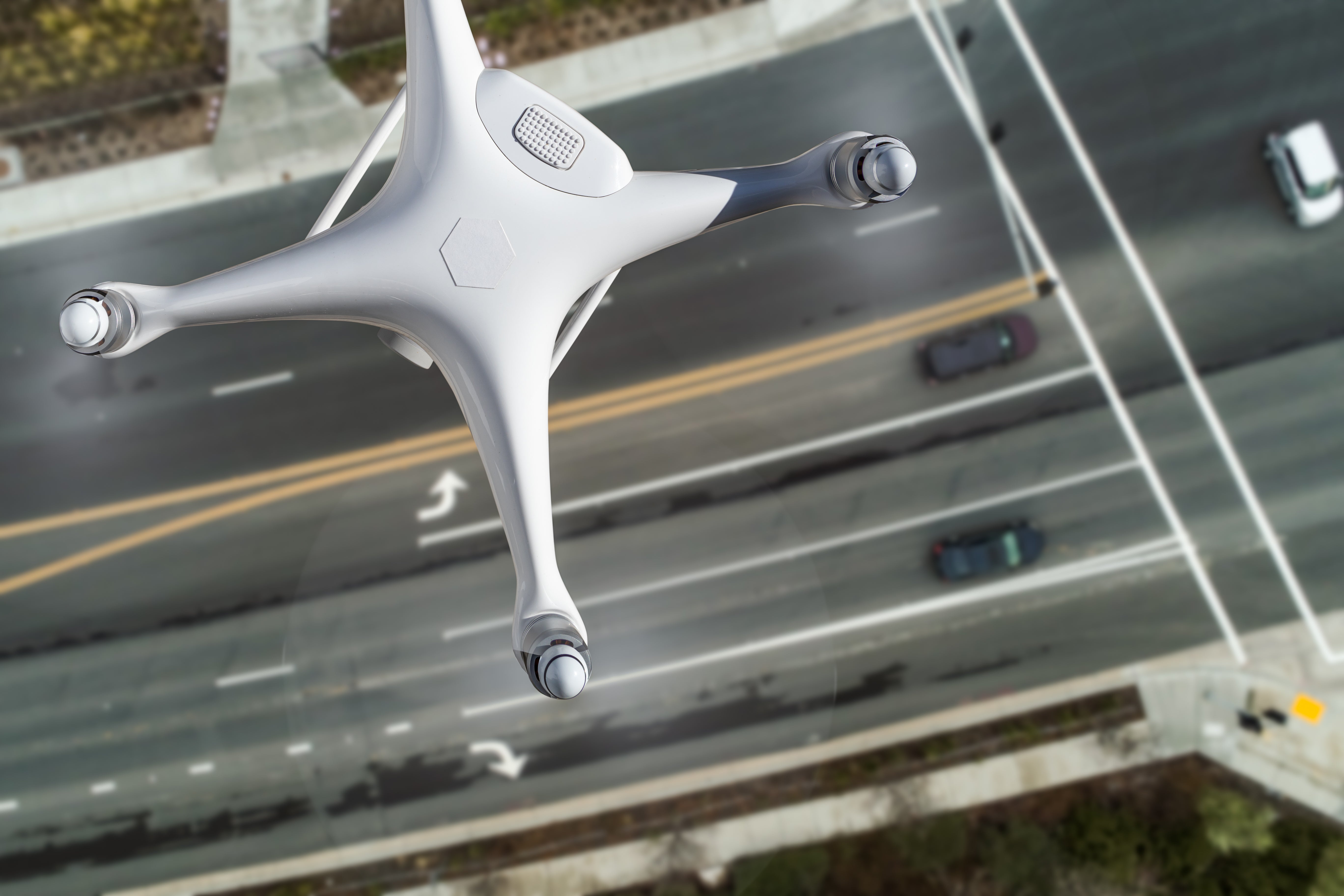 drone flying above a roadway and intersection
